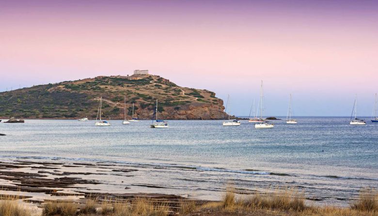 cape-sounio-dusk-view-picturesque-bay-anchored-boats-athens-greece-sounion-site-ruins