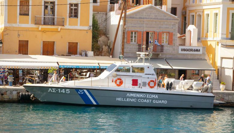 may-symi-island-greece-greek-coast-guard-ship-pier-may-symi-island-greece-greek-coast-guard-ship-pier