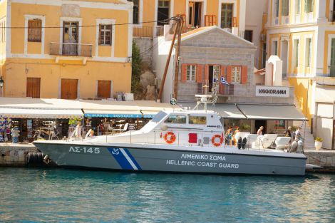 may-symi-island-greece-greek-coast-guard-ship-pier-may-symi-island-greece-greek-coast-guard-ship-pier